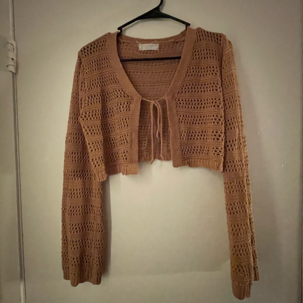 Cute caramel colored crochet sweater. Sleeves are long and flowy.